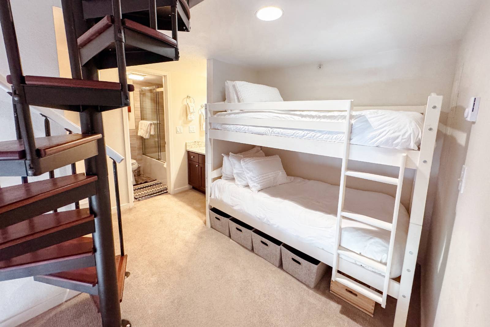 two single beds stacked one another in a room